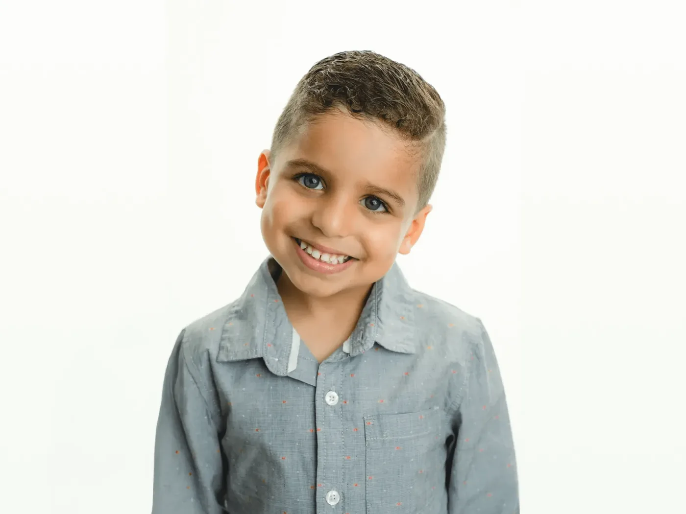 Child smiling at a pediatric dental appointment